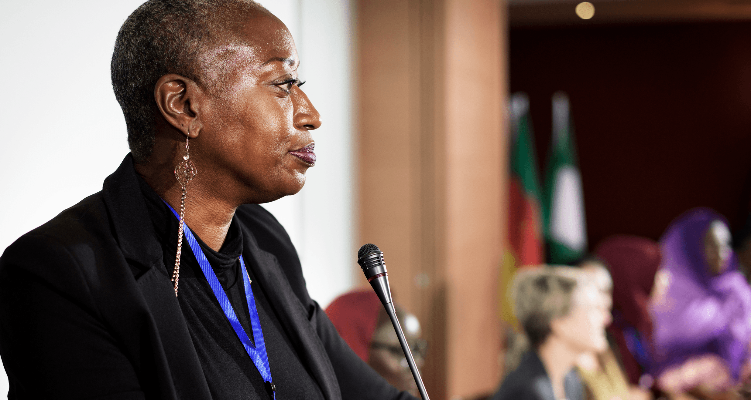A senior public sector leader speaking at a government press briefing